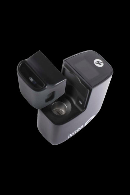 Black Sutra vaporizer open, revealing the herb chamber.