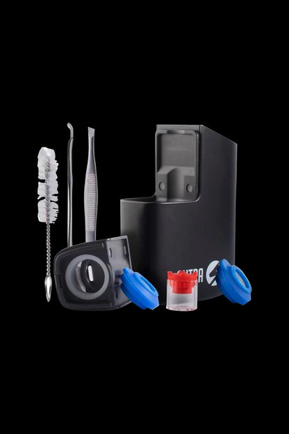 Cannabis consumption kit including a portable vaporizer, cleaning tools, and silicone containers.