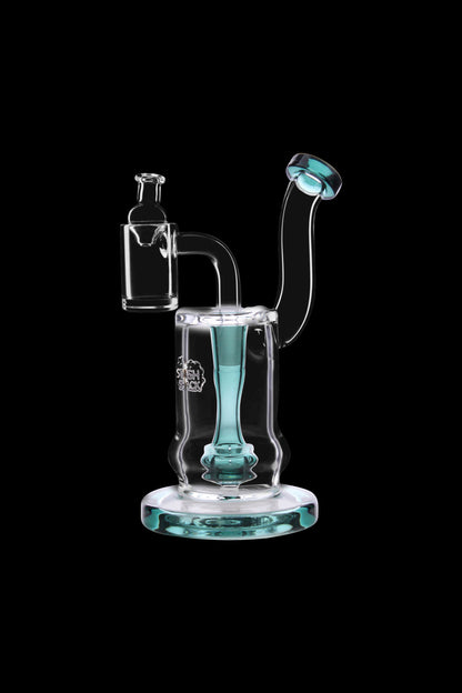 A clear glass water pipe (rig) with a turquoise accent and intricate design, isolated on a black background.