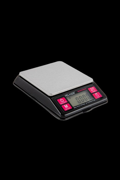 Digital scale with stainless steel platform, used for measuring cannabis.