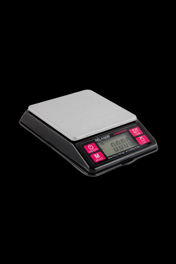 Digital scale with stainless steel platform, used for measuring cannabis.