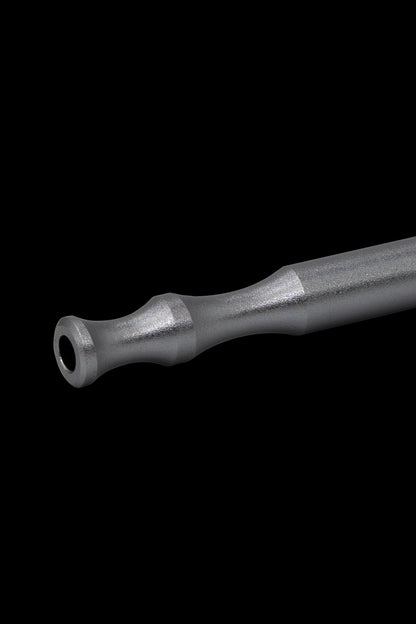Black titanium dab tool with a rounded tip, isolated on a black background.