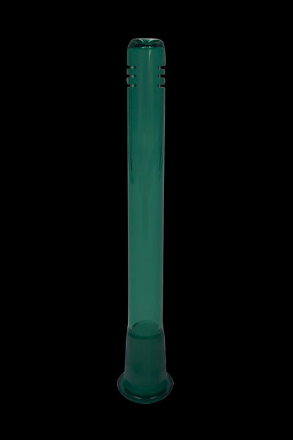 Green glass bong isolated on a black background.