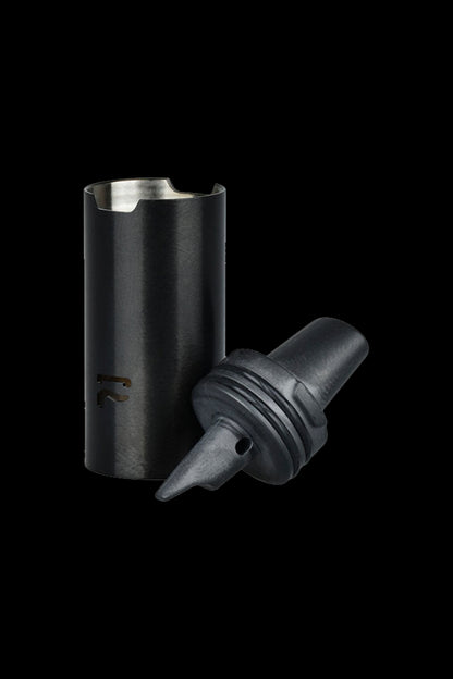 Black cannabis concentrate container with a silicone insert.