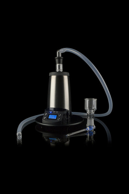 Black cannabis vaporizer with glass bubbler attachment and clear tubing, studio shot.