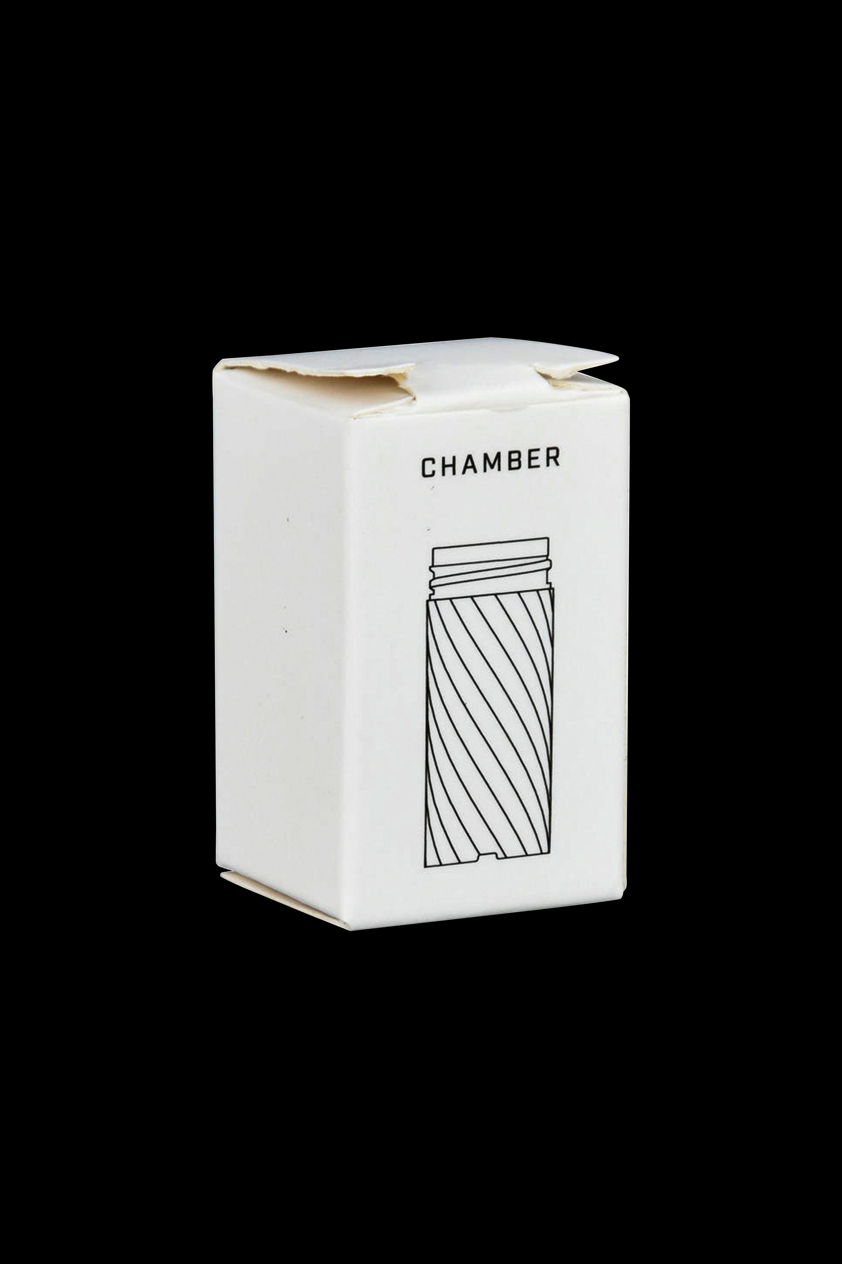 White packaging box for a cannabis accessory, featuring a line drawing of a cylindrical smoking device labeled "CHAMBER."