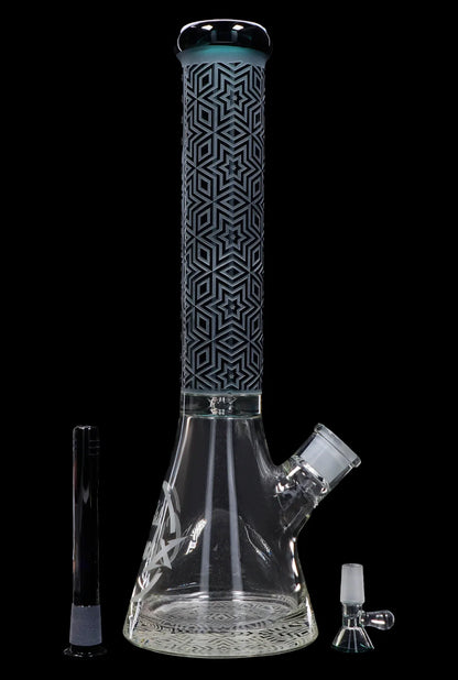A tall, patterned glass bong with a flared base, accompanied by a downstem and bowl.