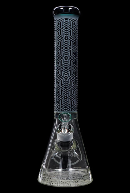 Glass bong with intricate geometric pattern and percolated base, isolated on black.