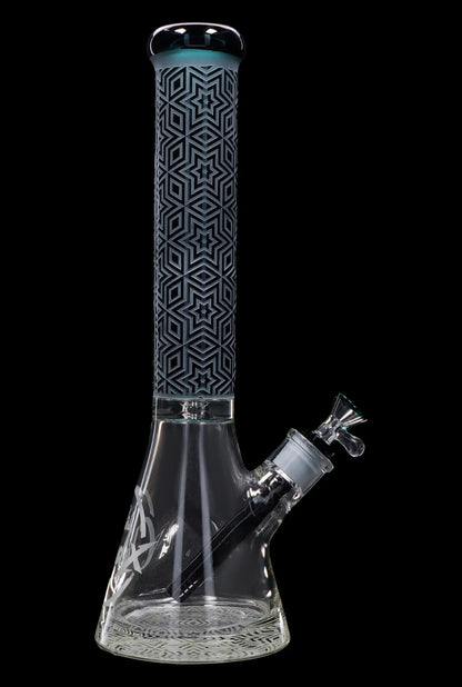 Tall glass bong with geometric patterns and intricate etching, isolated on a black background.
