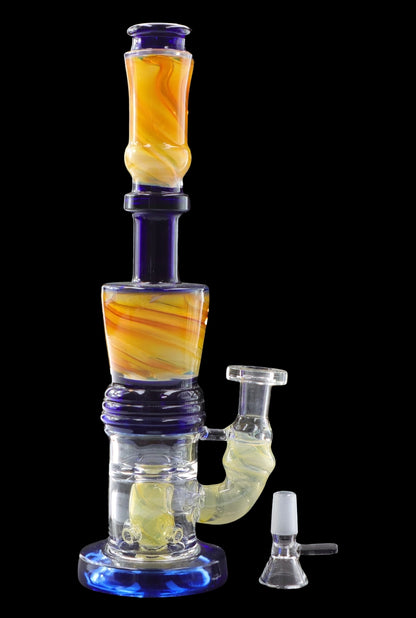 A colorful glass water pipe (bong) with a detachable downstem and bowl, isolated on a black background.