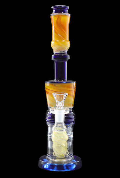 Blue and orange glass water pipe (bong) with a glass bowl, isolated on a black background.