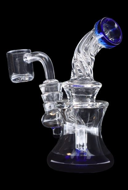 Clear glass dab rig with blue accents and a quartz banger.