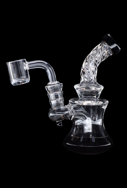 Clear glass dab rig with quartz banger, isolated on black.