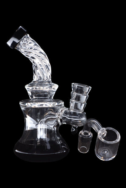 Clear glass water pipe (rig) with attachments against a black background.