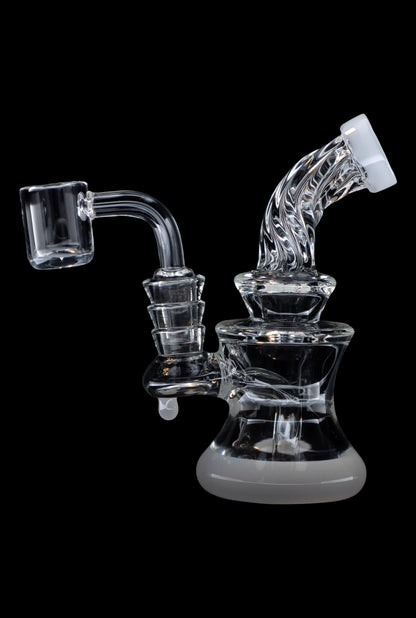 Clear glass dab rig with quartz banger, isolated on a black background.