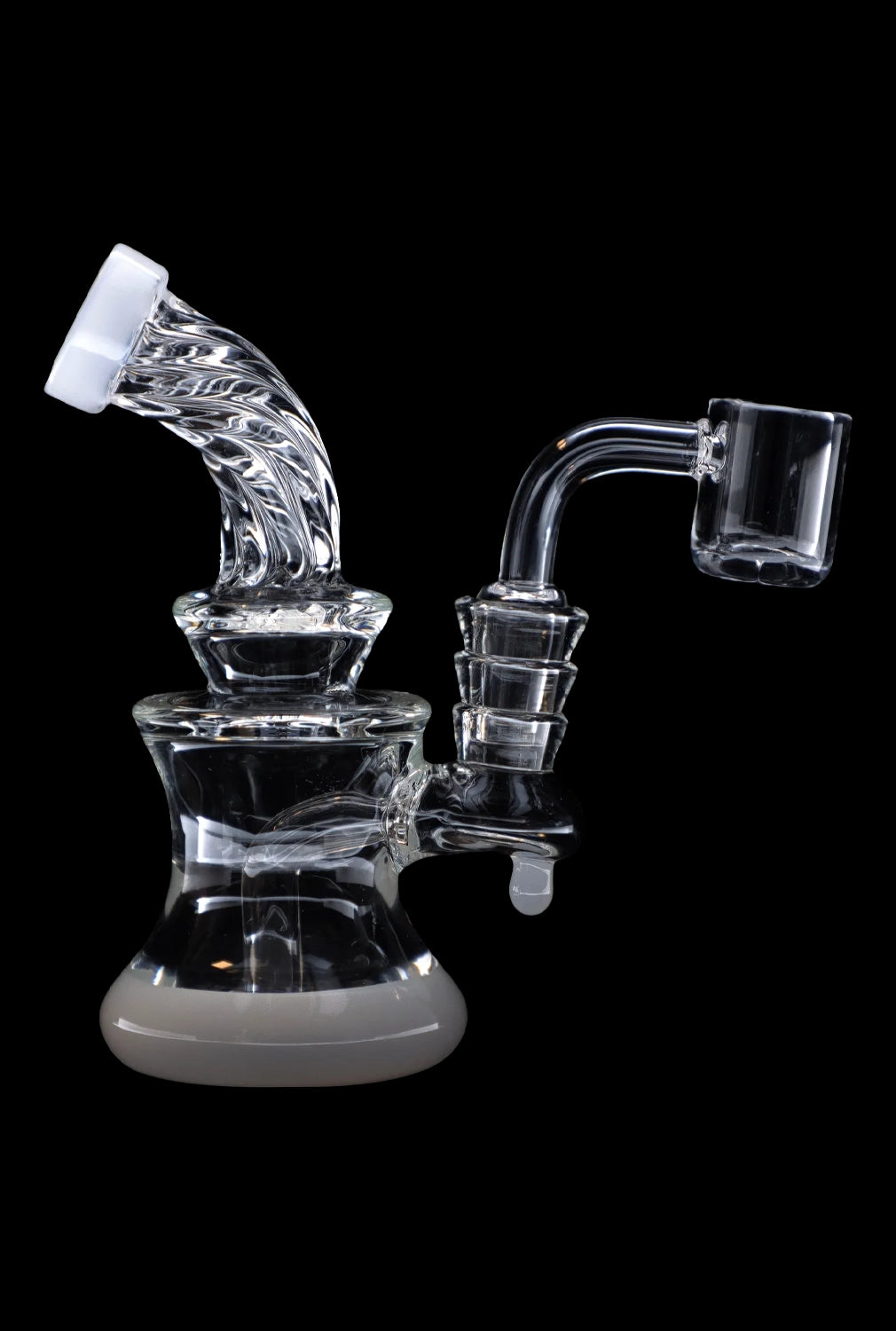 Clear glass dab rig with intricate percolators and a quartz nail, isolated on a black background.