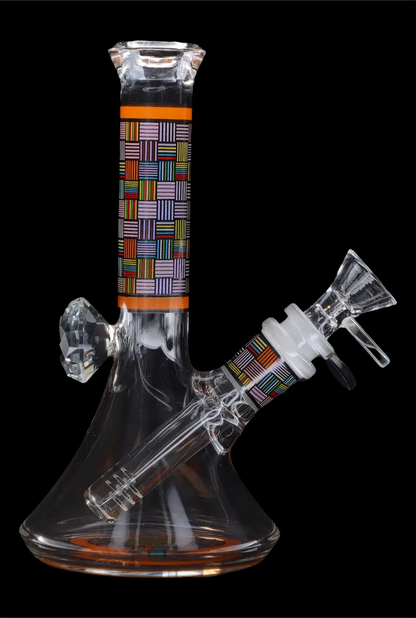 Glass water pipe (bong) with colorful geometric pattern, isolated on black.
