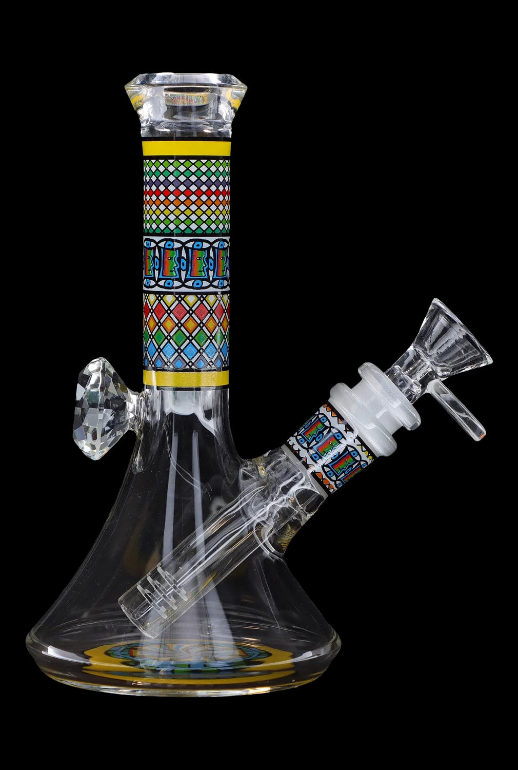 Glass bong with intricate geometric patterns and a clear base, isolated on a black background.