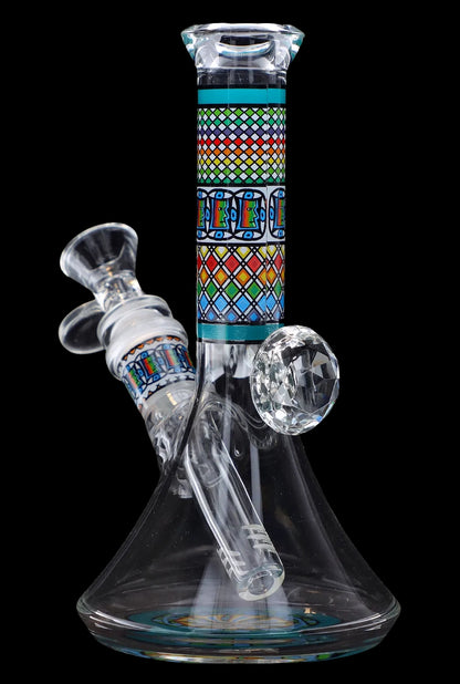 Hand-blown glass water pipe (bong) with colorful geometric patterns.