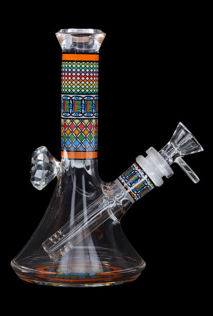 Front view of the 7-inch Diamond Beaker with Colourful Tube, showcasing its patterned glass and beaker shape against a dark background.