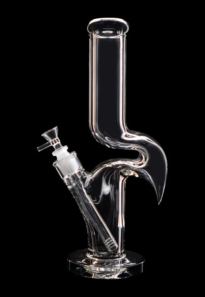 Clear glass water pipe (bong) with intricate curves and a removable bowl piece, isolated on a black background."