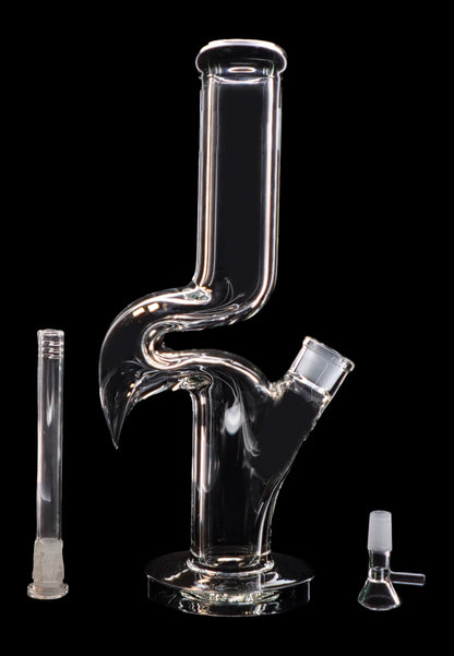 Clear glass water pipe (bong) with a perc filter and accompanying glass downstem and bowl, isolated on a black background.