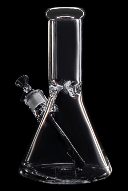 Clear glass bong with a flared base and angled neck, isolated on a black background.