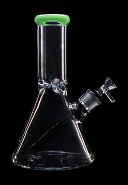 Clear glass bong with a green mouthpiece against a black background.