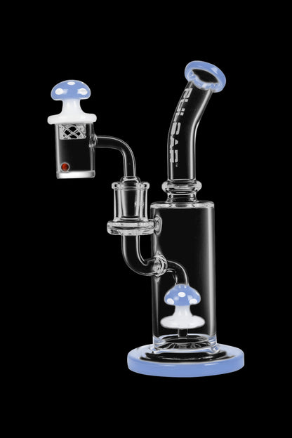 Blue glass dab rig with mushroom-shaped accents and a quartz banger, isolated on a black background.