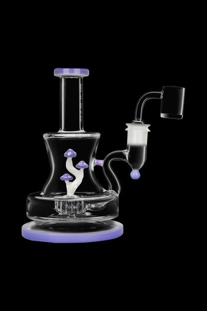Glass dab rig with mushroom-shaped percolators, featuring a quartz banger and lavender-colored accents, against a black background.