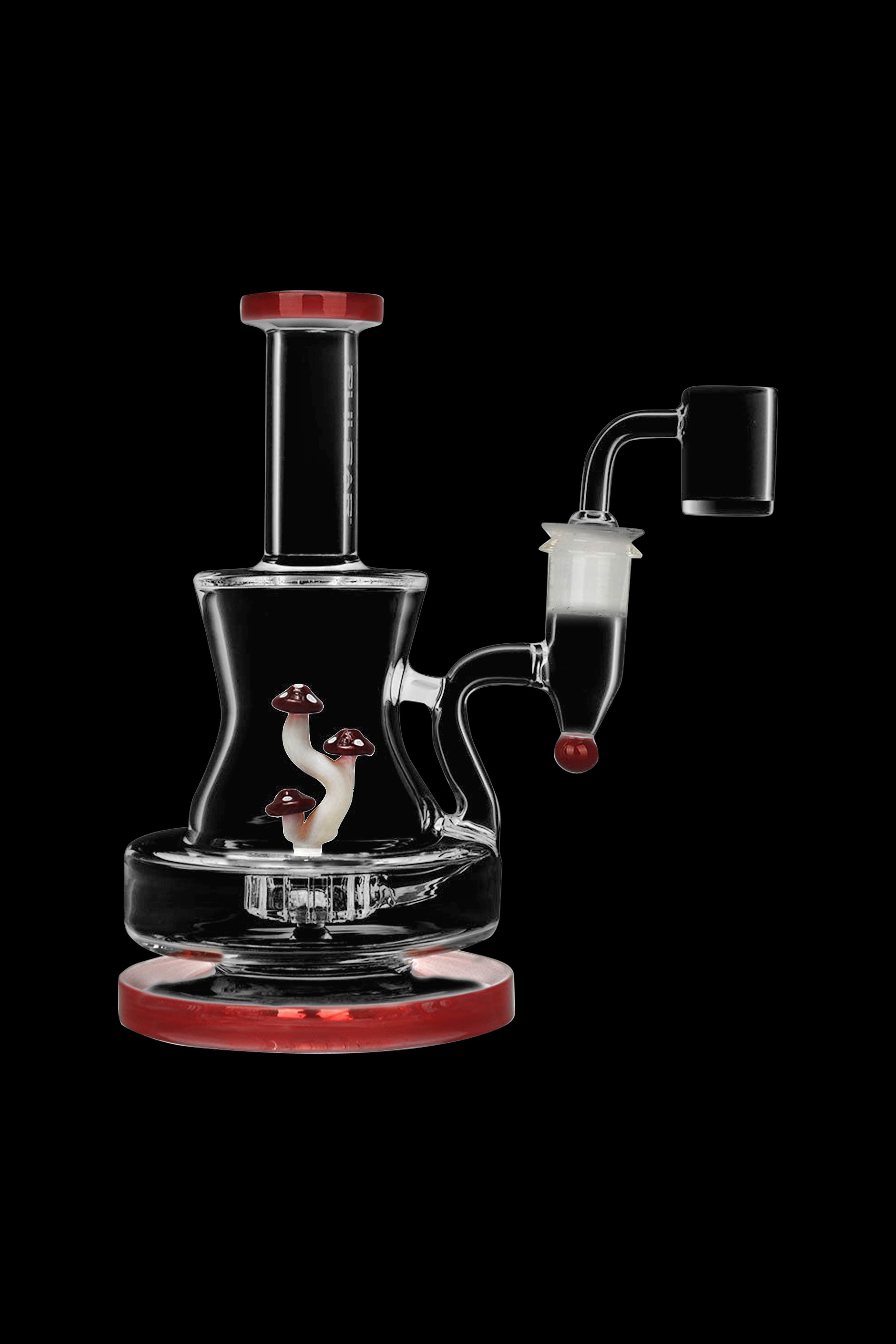 Glass water pipe (rig) with mushroom-themed detailing and a quartz banger.