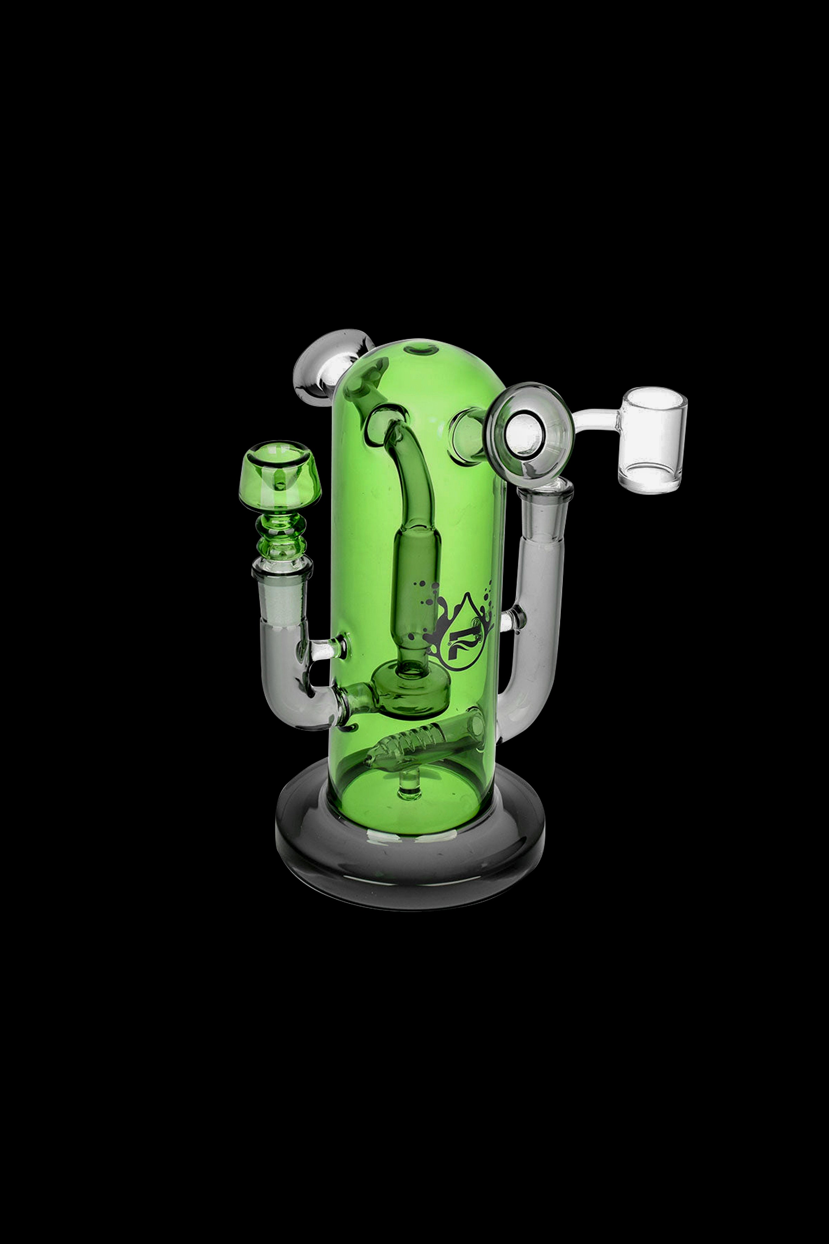 Green glass bubbler water pipe with intricate design and attachments, studio shot on black background.