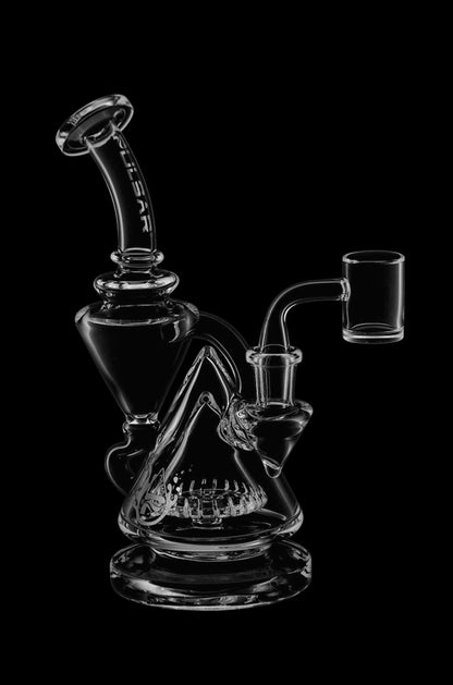 Clear glass dab rig with intricate percolator and accompanying quartz banger, isolated on a black background.