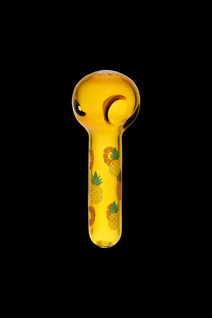 Golden glass pipe decorated with pineapple designs.