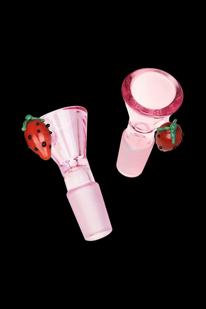 Pink glass bowl with sculpted strawberry detail, used for smoking cannabis.