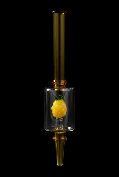 Centered vertical studio shot of the Pulsar Fruit Series Pineapple Express Glow In The Dark Dab Rig Kit - 8" / 14mm F, showing a clear chamber with a small yellow pineapple inside against a black background
