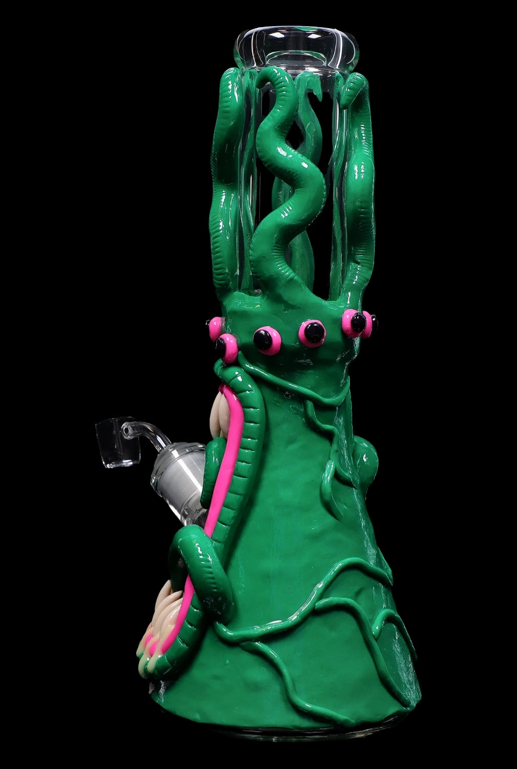 Green glass water pipe shaped like a monster with tentacles and pink accents.