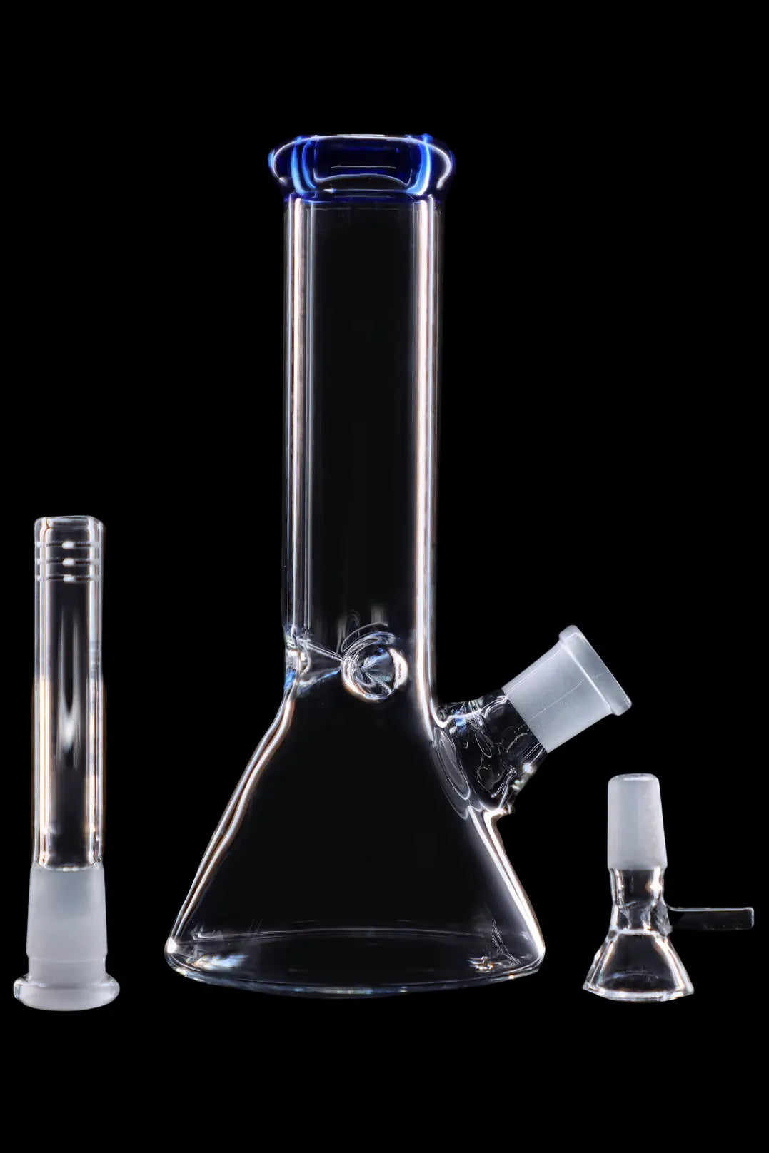 Clear glass bong and accessories on a black background.