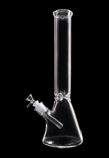 Clear glass bong against a black background.