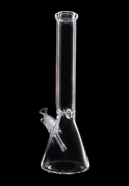 Clear glass bong against a black background.