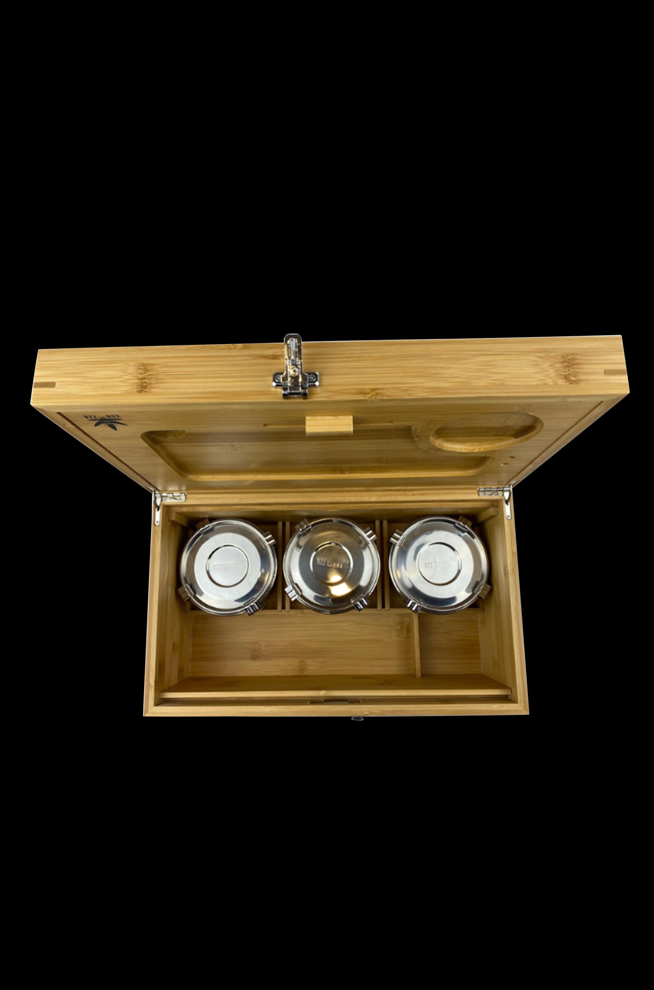 Wooden cannabis storage box with three glass jars inside, viewed from above.
