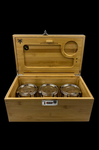 Wooden storage box open, displaying three glass jars and cannabis accessories inside.