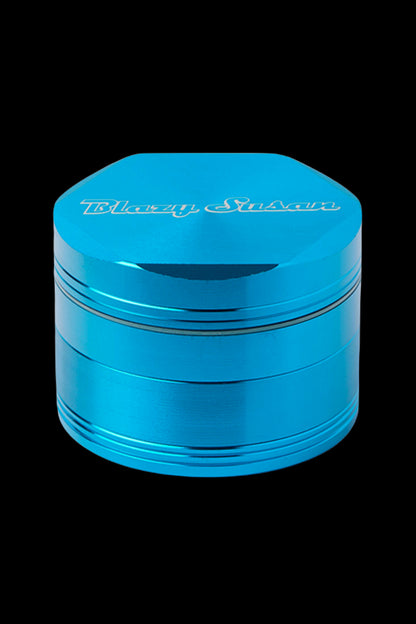 Blue four-piece metal cannabis grinder with “Planet Herb” logo.