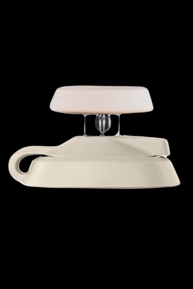 Beige silicone carb cap for use with cannabis concentrates.
