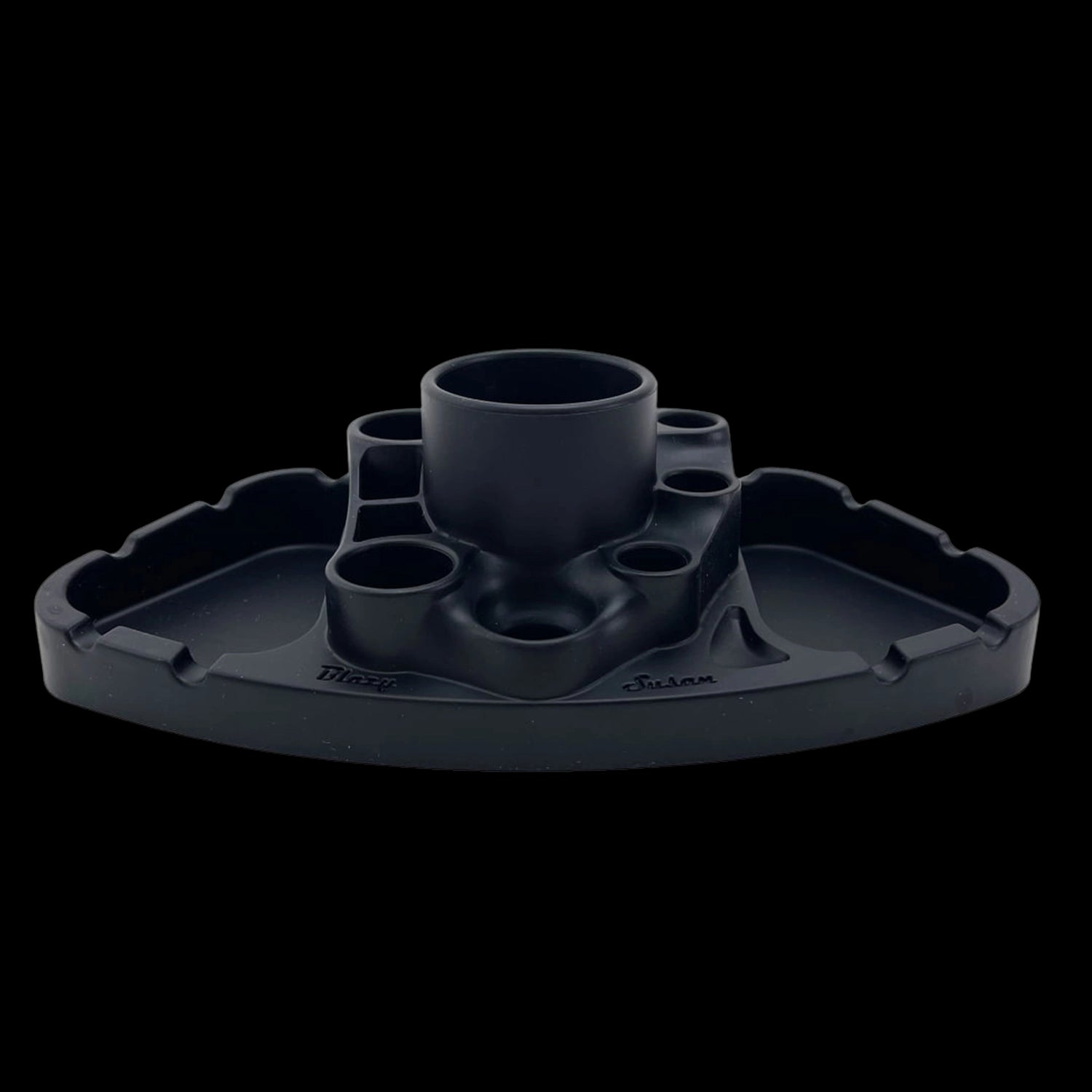 Front-facing studio shot of a matte green Blazy Susan Deluxe Dab Station with central cup and multiple recessed holders against a black background