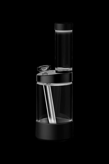 Sleek, transparent cannabis rig with a cylindrical design and internal water chamber, isolated on a black background.