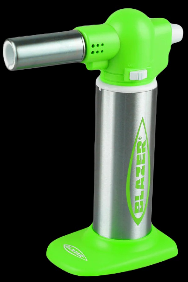 Green and silver butane torch lighter with "Blazer" logo.