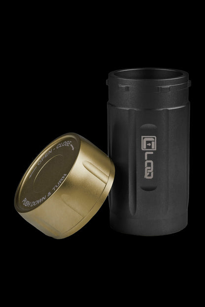 Black and gold cannabis storage container with a twist-to-open lid.