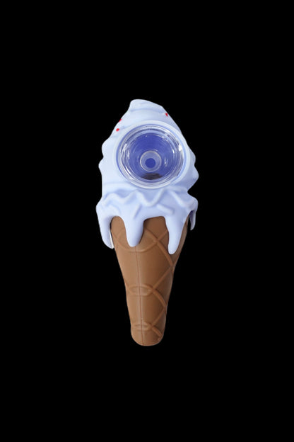 Glass pipe shaped like an ice cream cone against a black background.