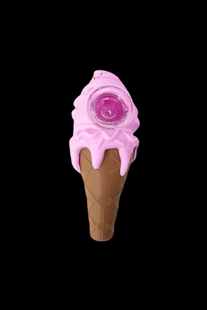 Pink ice cream cone-shaped glass pipe against a black background.
